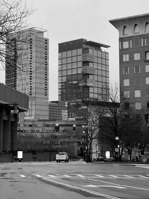 Free Monochrome view of urban city street with tall skyscrapers in the background. Stock Photo