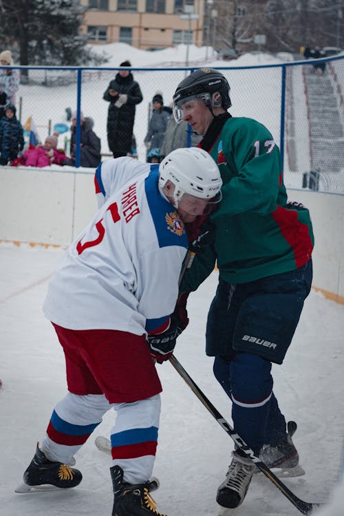 Men Playing Ice Hockey in Winter