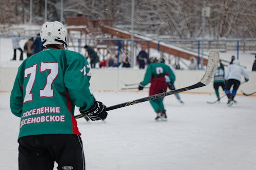 Back View of Men Playing Ice Hockey