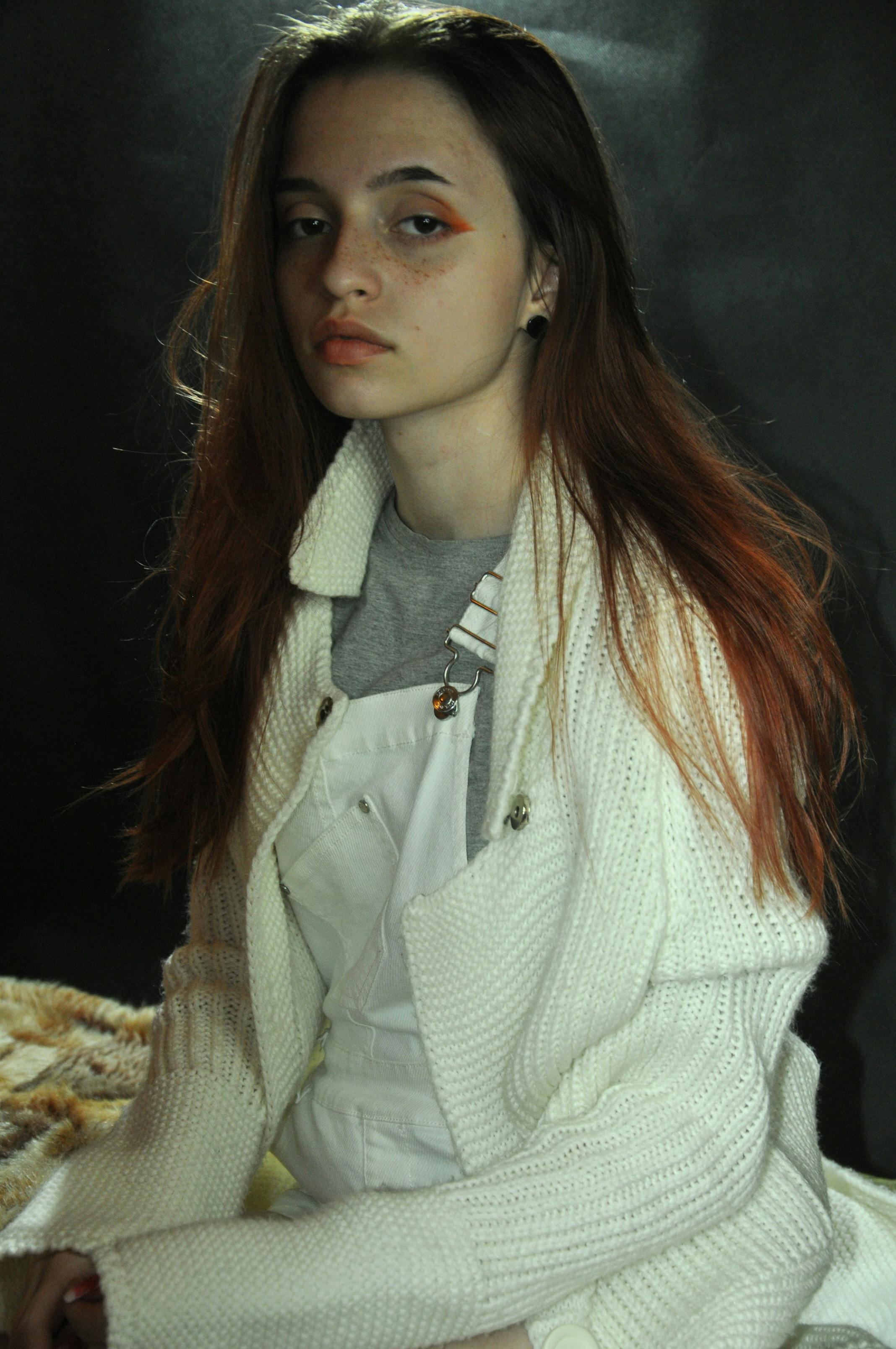 Portrait of a woman in winter fashion with neutral tones.