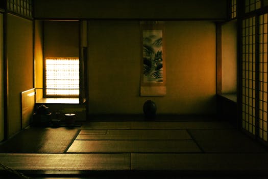 Explore the tranquility of a traditional Japanese tatami room with soft lighting and minimalist design.