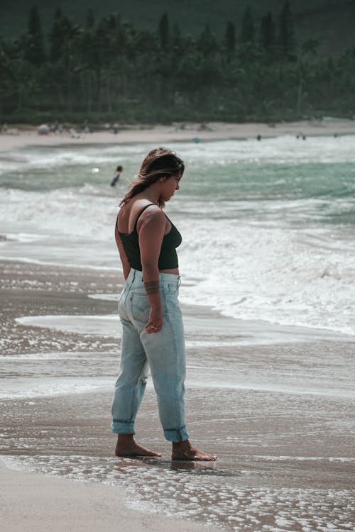 Woman Walking on Seashore