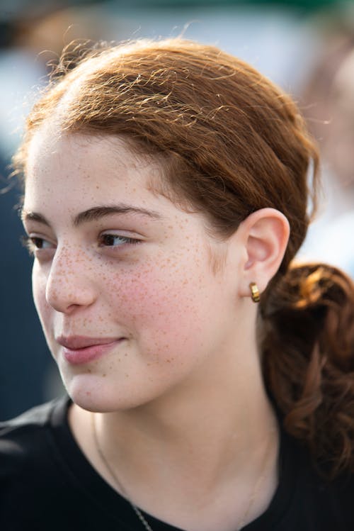 Portrait of a Young Freckled Woman
