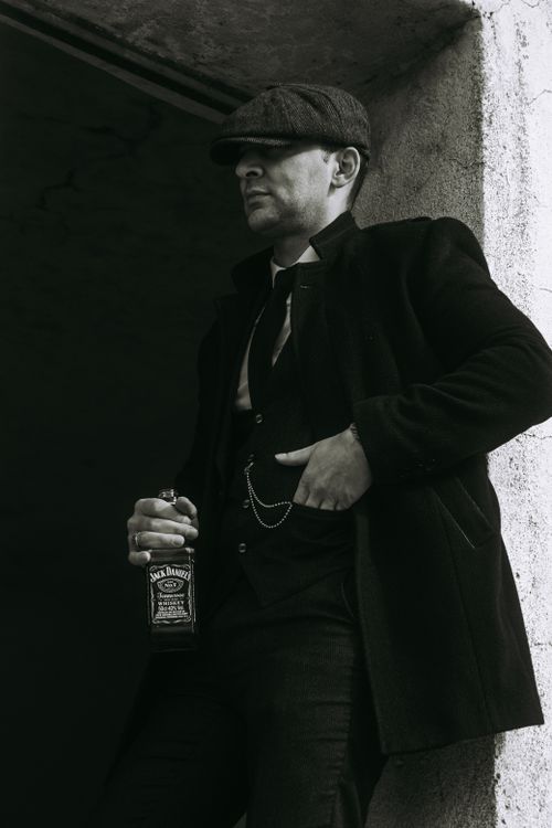 Man Standing in the Doorway with a Bottle of Jack Daniels · Free Stock Photo
