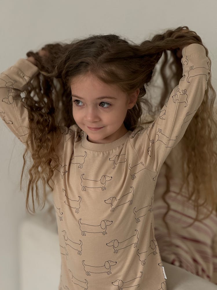 Portrait Of A Little Girl With Long Curly Hair