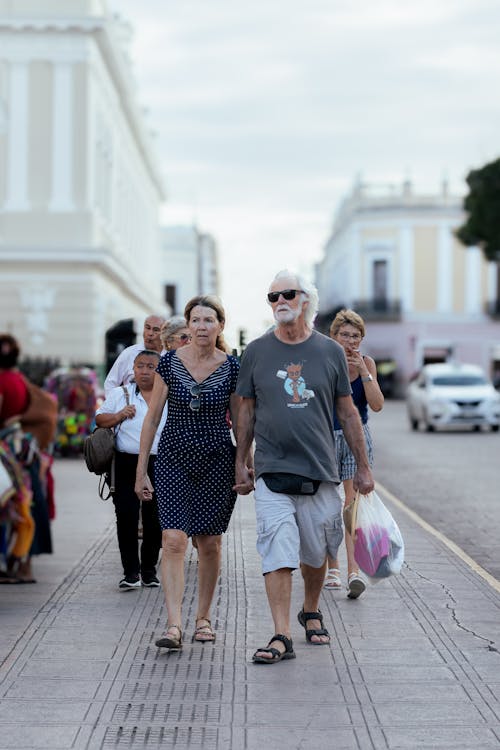 Elderly Couple Walking on Street