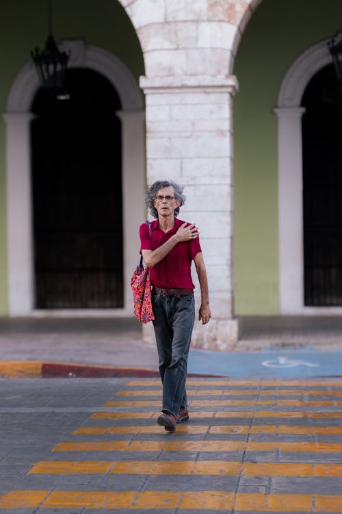 A woman crossing the street in havana, cuba