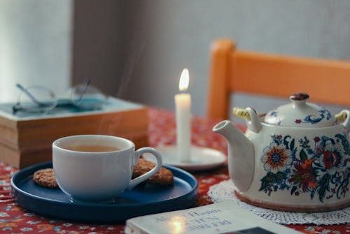 Tea with Cookies by the Candle and a Book