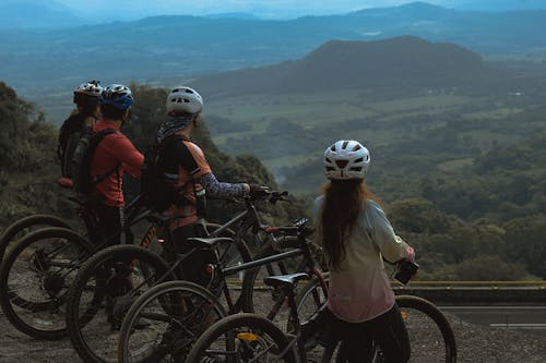 Women and Men with Bikes on Hilltop
