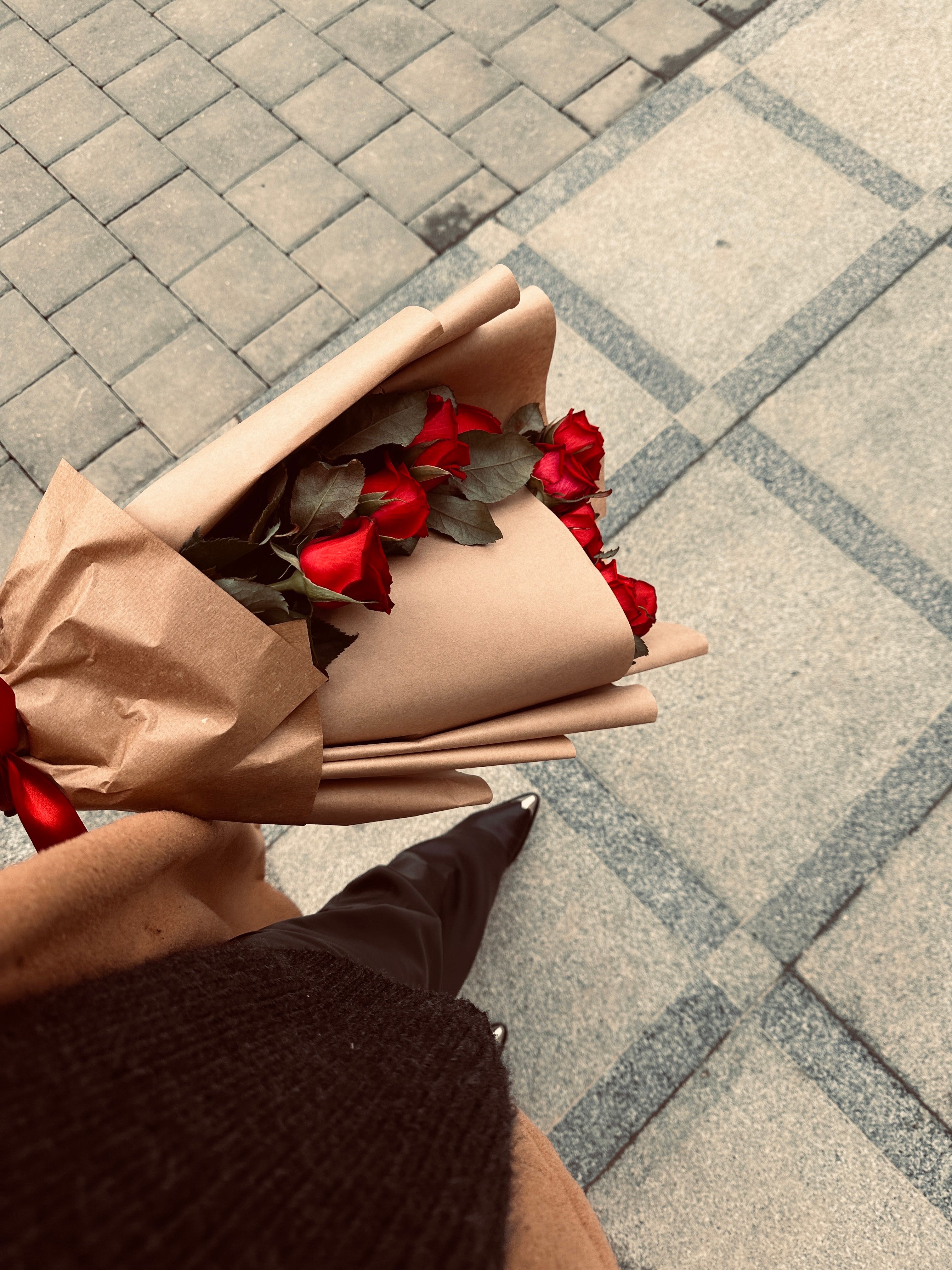 Woman Holding Bouquet of Red Roses on a Street · Free Stock Photo
