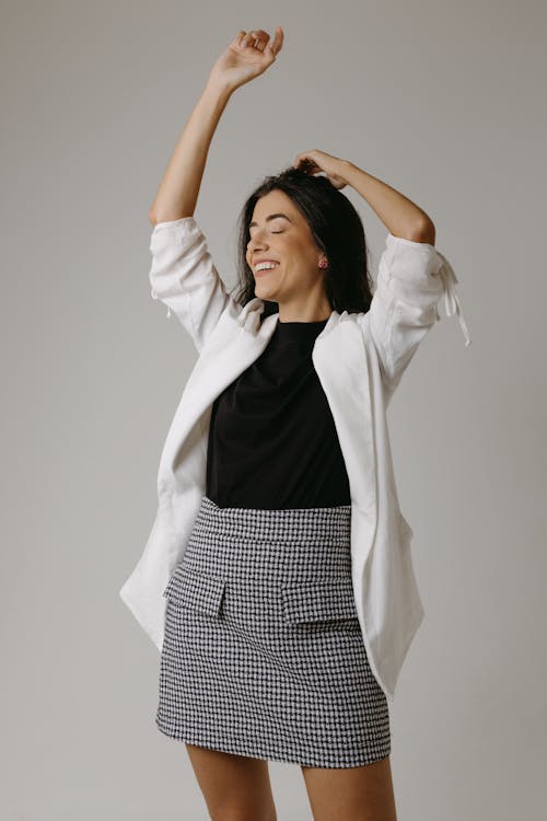 Studio Shot of a Young Brunette in a Fashionable Outfit 