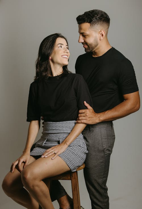 Studio Shot of a Couple in Fashionable Outfits 