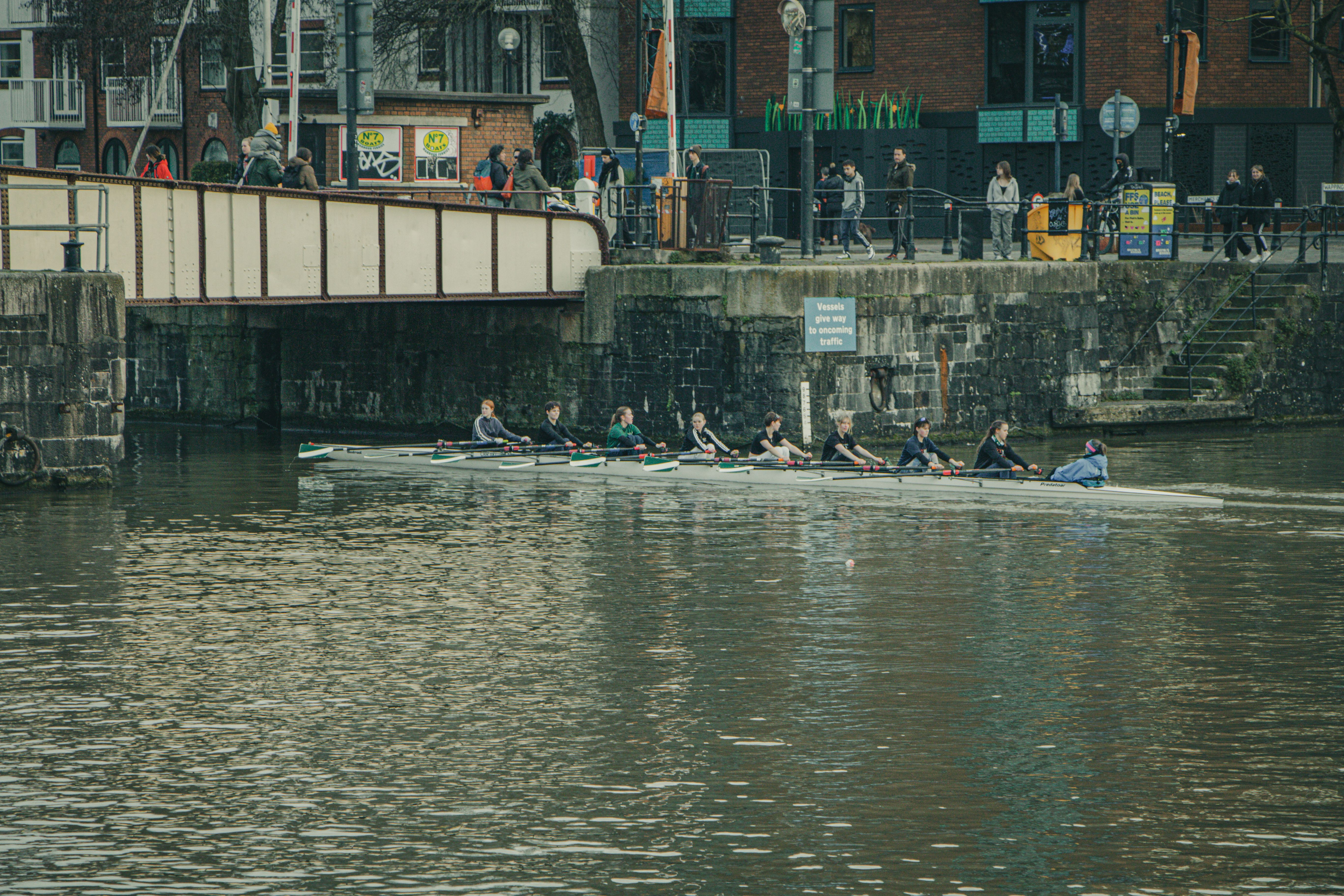 View of People Rowing in a Rowboat on a River in City · Free Stock Photo