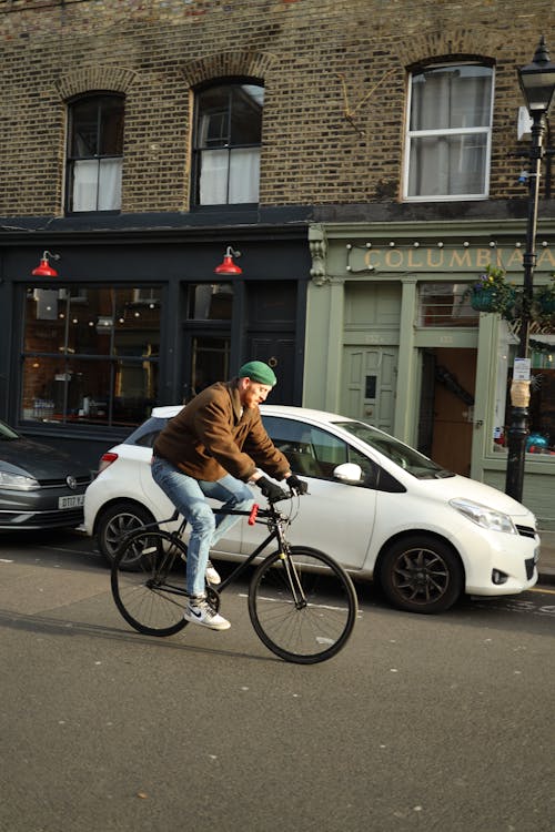 Man Riding a Bike on a City Street