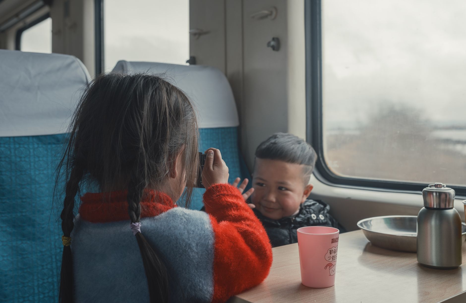 Children playing happily during travel