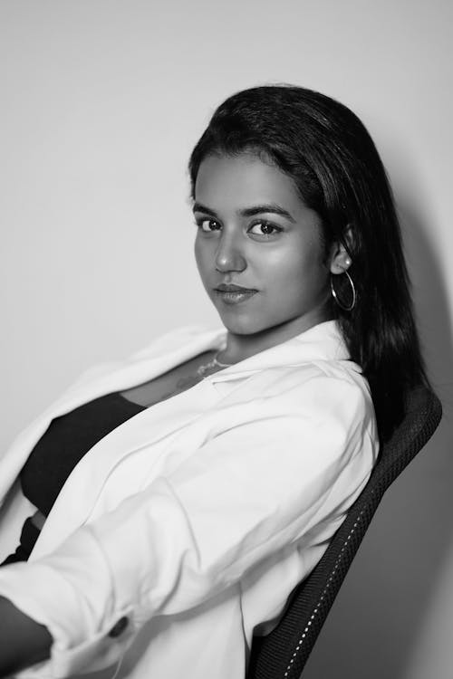 Black and White Photograph of a Young Brunette Wearing a Suit