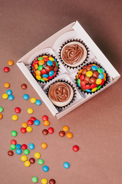 A Box of Cupcakes with Colorful Sprinkles 