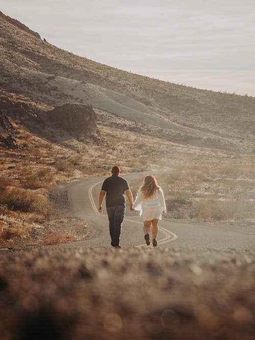 Holding Hands Couple Walking Road