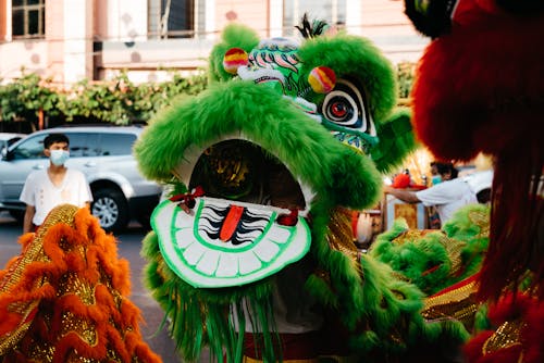 A chinese dragon is dressed in green and red