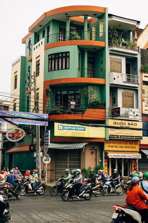 A busy street with motorcycles and cars