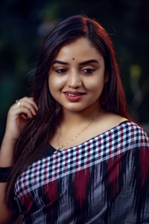 Portrait of a Smiling Woman in Traditional Attire · Free Stock Photo