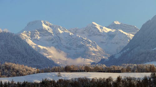 Foto profissional grátis de cadeia de montanhas, com frio, inverno