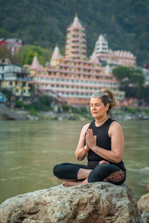 Meditating in the Lotus Position on the Riverbank of the Ganges