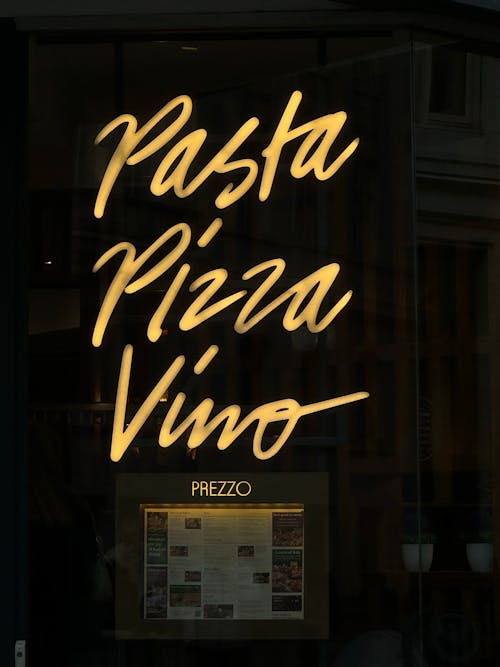 Neon Text on Window of Italian Restaurant