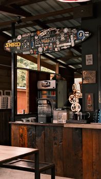 A cozy café interior featuring rustic wooden design and surf-themed décor for a laid-back vibe.