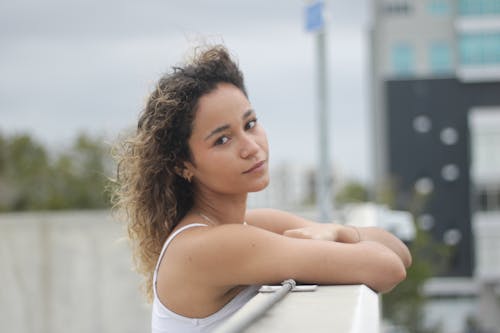 Woman Standing and Leaning on Railing