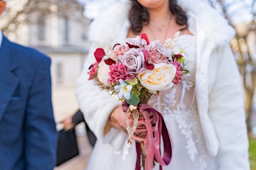 Bride Walking with Flowers Bouquet