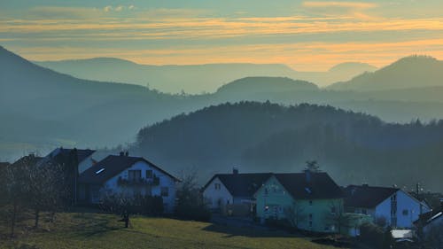 Free Houses in Mountains at Dawn Stock Photo