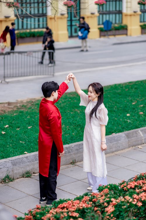 Asian Couple Dancing on a Street 