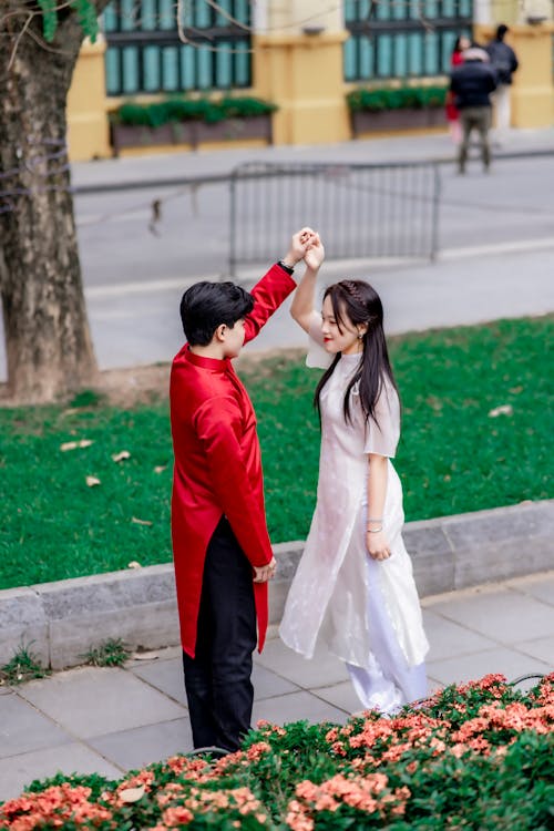 Asian Couple Dancing on a Street 