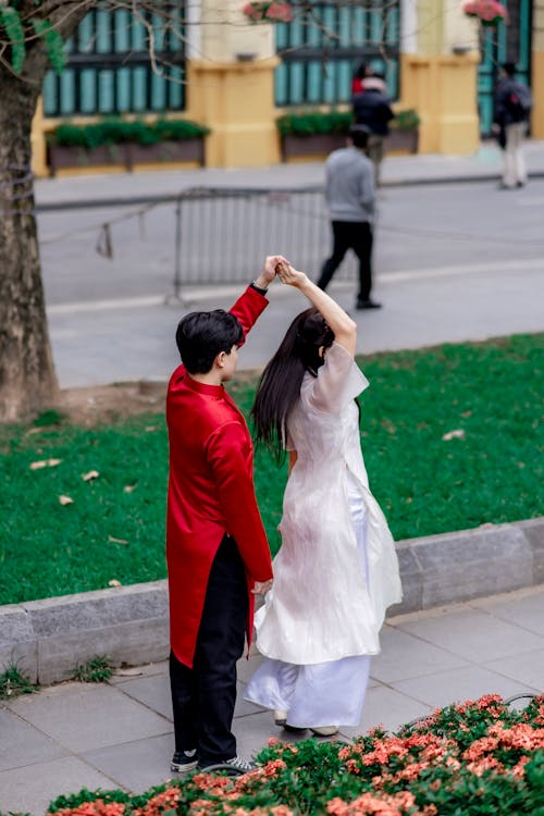 Asian Couple Dancing on a Street 