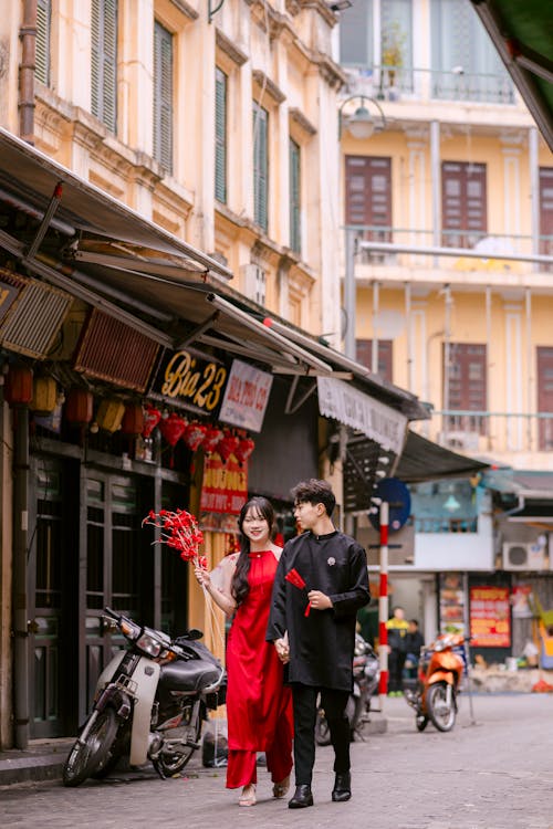 Couple Walking on a Street in Asia