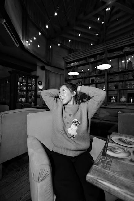 A cozy, warmly lit restaurant interior with vintage-inspired decor and happy diners enjoying their meals.
