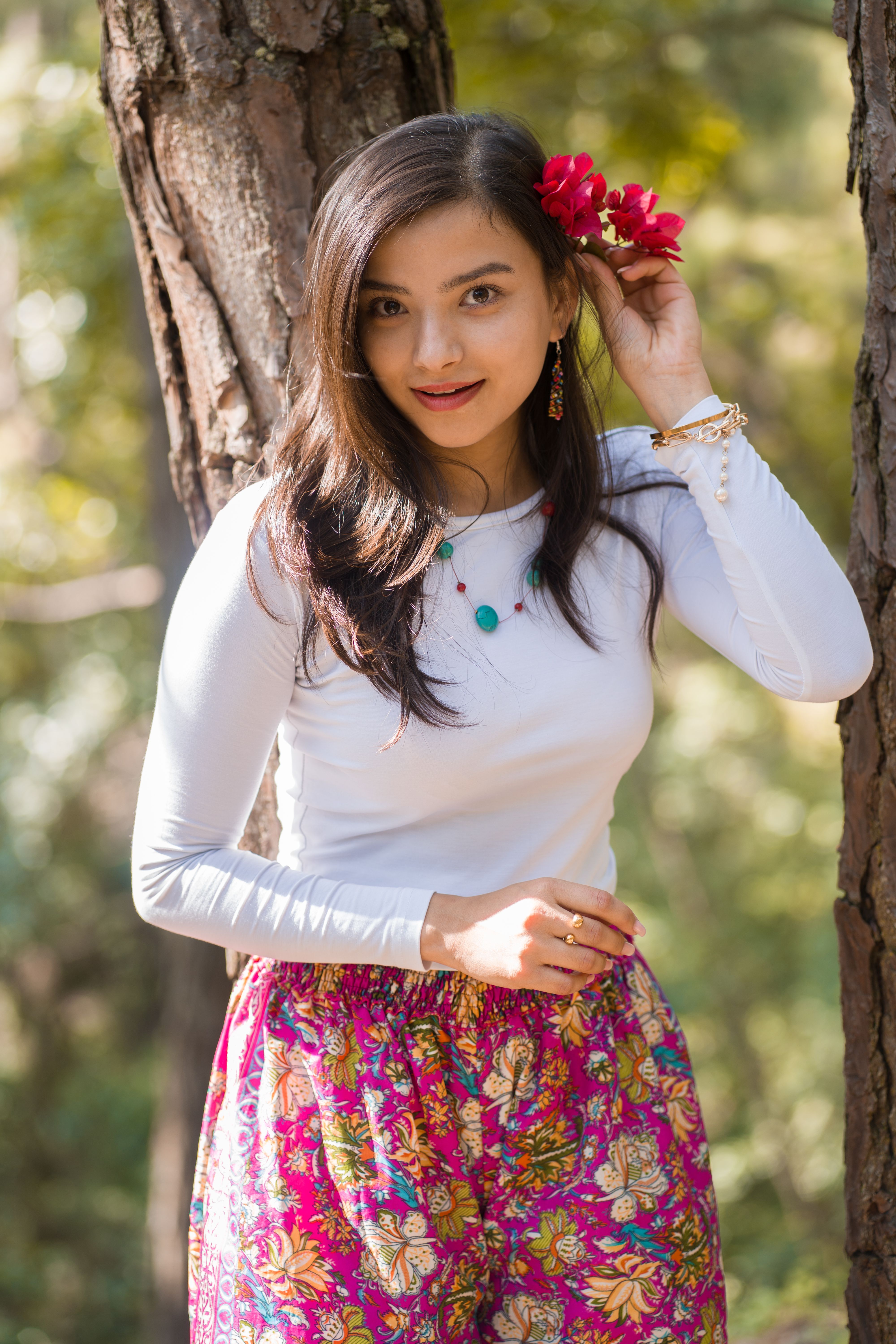 Portrait of Woman with Flowers in Hair · Free Stock Photo