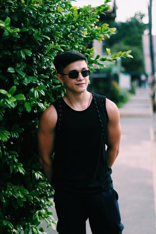 Portrait of Man in Sunglasses and Tank Top
