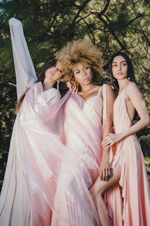 Portrait of Three Women in Pink Dresses