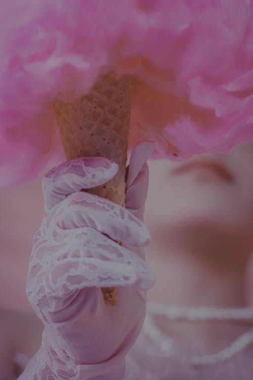 Bride Hand in Glove Holding Ice Cream Cone with Pink Feathers