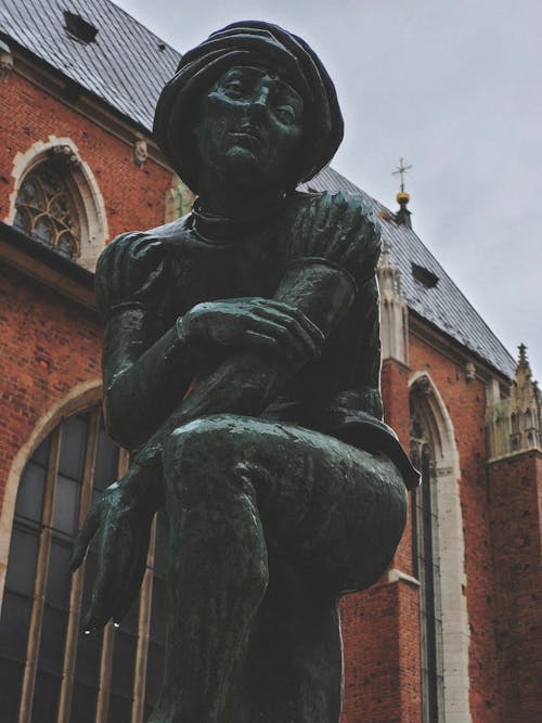 Statue of a Student in front of the St Barbaras Church in Krakow, Poland 
