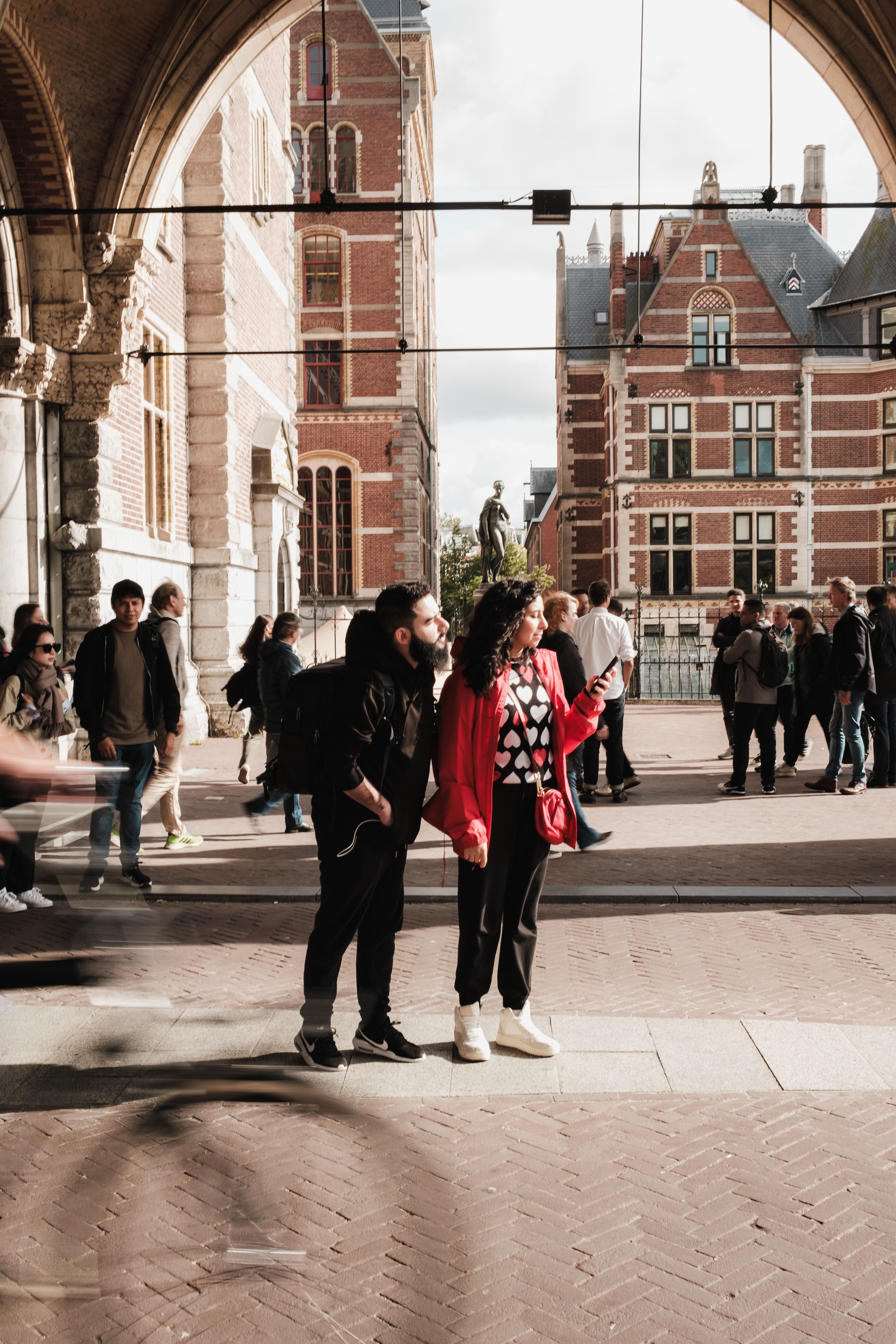 Young couple planning travel together with laptop and map