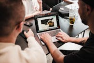 Back View of Men Using Laptop