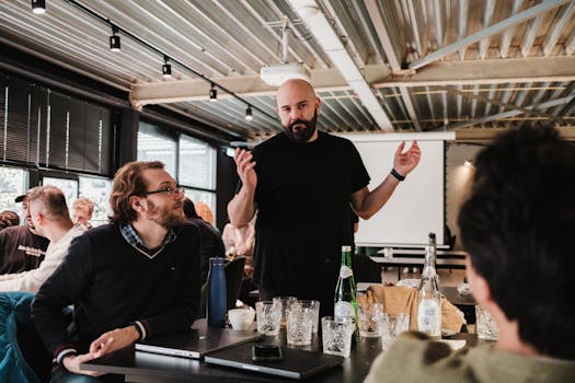 A team of colleagues engaged in a lively discussion in a modern office environment.