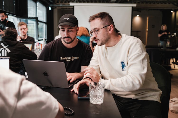 Men Working On Laptop On Table