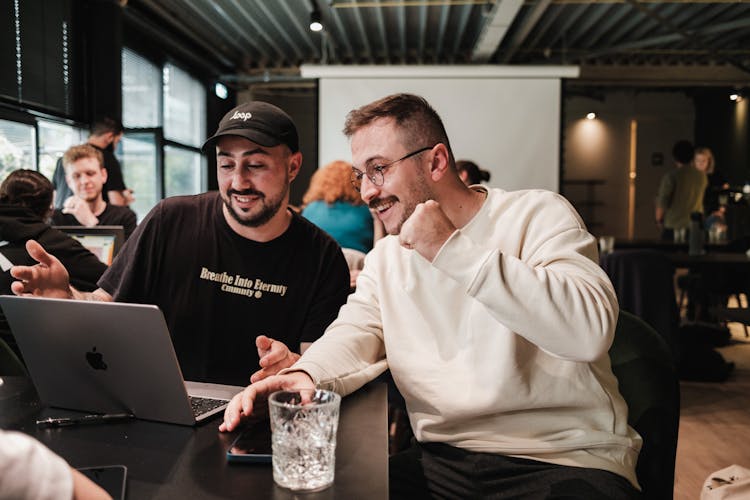 Smiling Men Working On Laptop