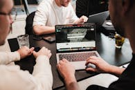 Hands of Men Working on Laptop