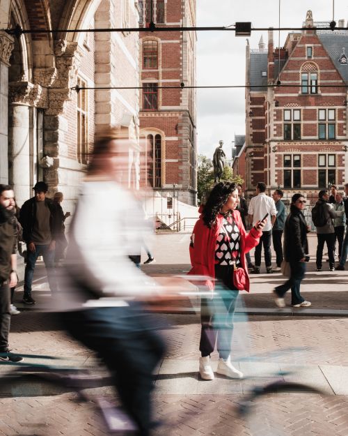 Free A vibrant street scene in Amsterdam's Museum District, capturing tourists and historic architecture. Stock Photo