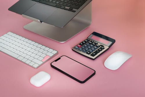 Wireless Electronics against Pink Background